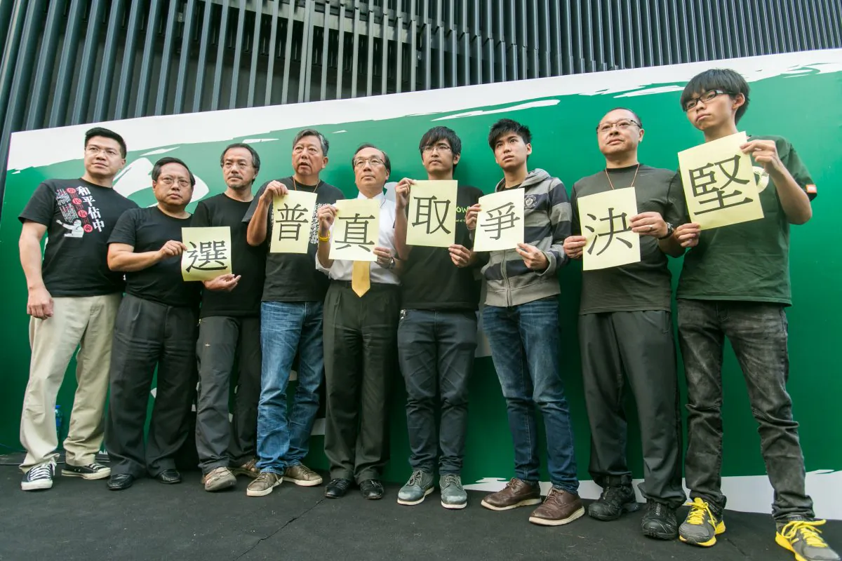 Some of the main organizers of Occupy Central along with Civic Party leader Alan Leong, (C) hold a press conference in the Central District of Hong Kong on Oct. 9, 2014. (Benjamin Chasteen/Epoch Times)