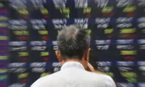 As Dow Average Drops Triple Digits, Investors Brace for Turbulence