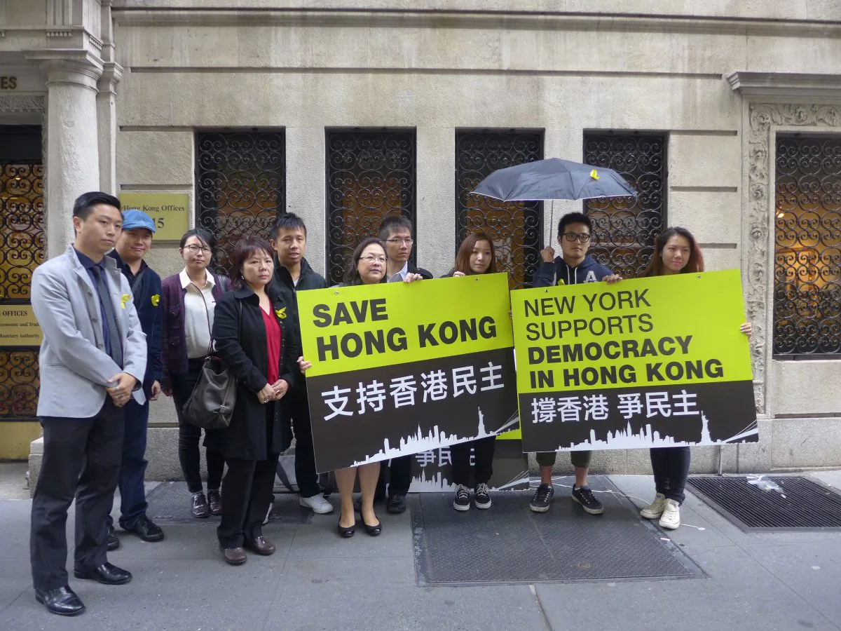 A group of New York supporters of the Hong Kong pro-democracy protesters gather in front of New York's Hong Kong Economic and Trade Office in midtown Manhattan, N.Y., on Thursday, Oct. 9, 2014. The group New Yorkers Supporting Hong Kong met with Hong Kong government representatives at the New York office to present demands that Hong Kongers living abroad and other supporters have for the government. (Hannah Cai/Epoch Times)