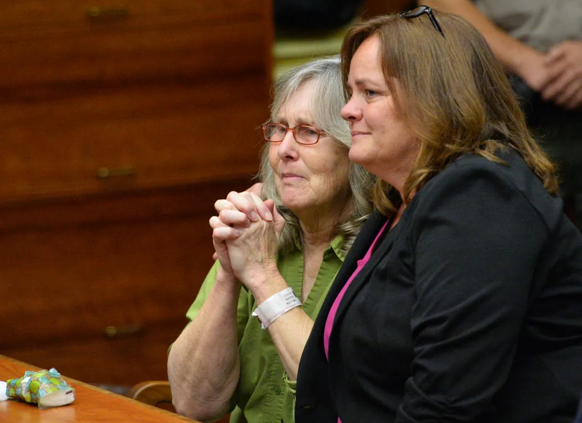 Susan Mellen, left, sits with her attorney Deirdre O'Connor, as she is exonerated of murder by Superior Court Judge Mark Arnold in Torrance, Calif., Friday, Oct. 10, 2014. Mellen spent 17 years in prison after being convicted of murder in the death of Richard Daly, a homeless man in 1997. The judge said Mellen had inadequate representation by her attorney at trial. The witness who claimed she heard Mellen confess, had a long history of giving false tips to law enforcement, according to documents in the case. Three gang members subsequently were linked to the crime, and one was convicted of the killing. (AP Photo/Daily Breeze, Brad Graverson, Pool )