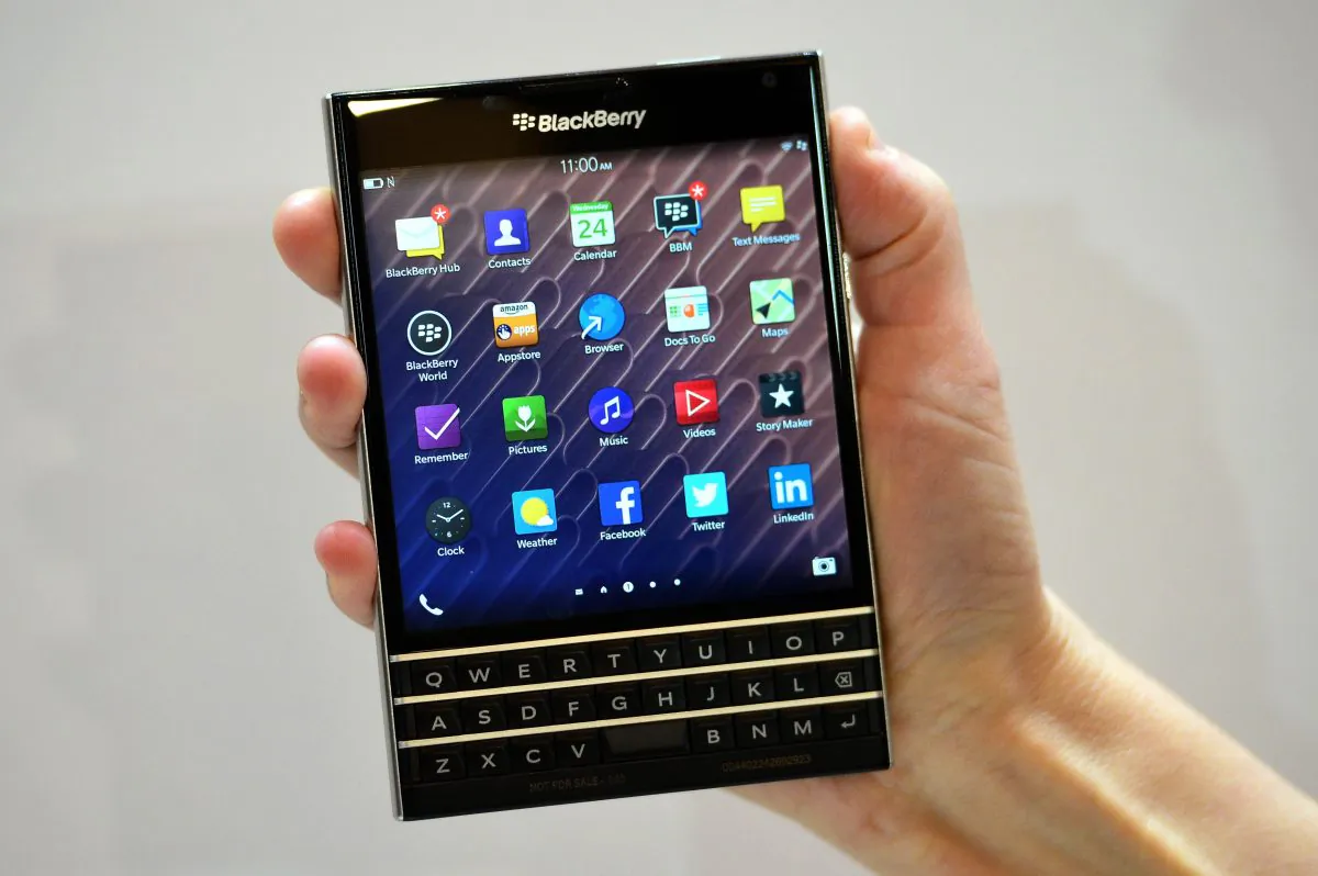 A woman holds the Blackberry Passport smartphone during at a simultaneous launch event in London on Sept. 24, 2014. (Carl Court/AFP/Getty Images)