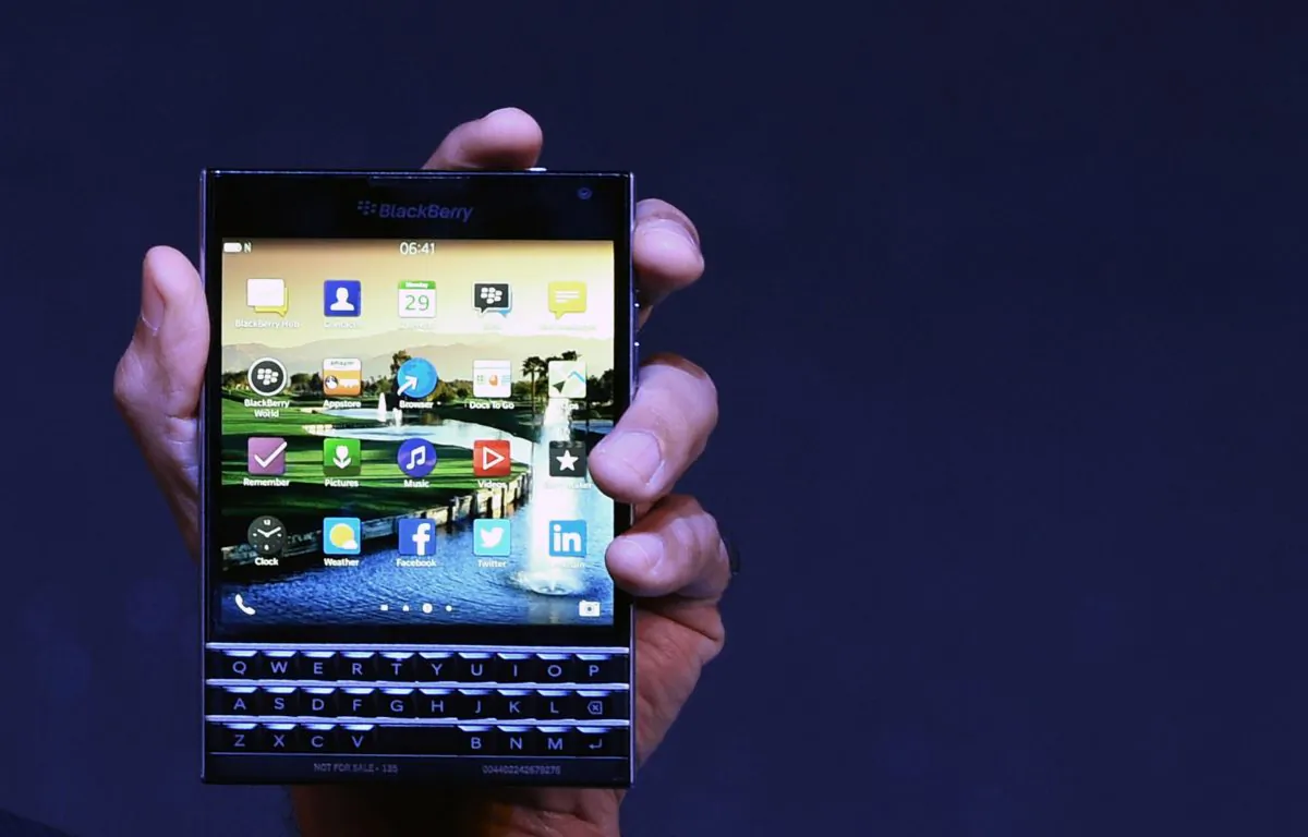 Sunil Lalvani, managing director of BlackBerry India, holds a newly launched BlackBerry passport smartphone at a function in New Delhi on Sept. 29, 2014. (Sajjad Hussain/AFP/Getty Images)
