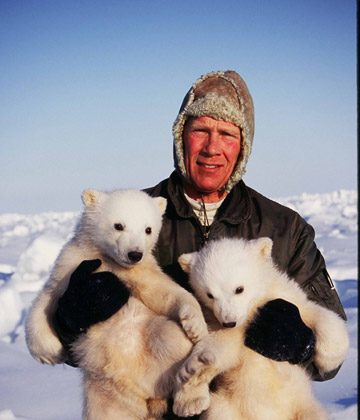 Steven Amstrup with a pair of polar bears during a research expedition. Photo courtesy of Steven Amstrup/Polar Bears International.
