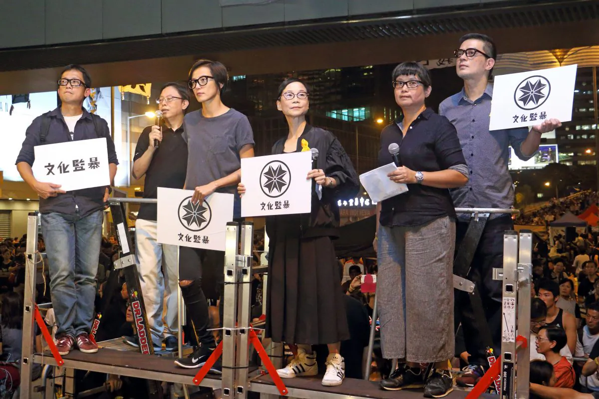 Leaders of Hong Kong Shield, a group formed by over 50 Hong Kong cultural figures, gave a speech at a rally at Pacific Place in Hong Kong on Oct. 10, 2014. Pictured are (from left to right) singer-songwriter Anthony Wong, Hong Kong film director Shu Kei, unidentified young man, professor at the University of Hong Kong Ho Sik-ying, Cantopop singer Denise Ho, and Hong Kong author Chen Hui. (Cai Wenwen/Epoch Times)