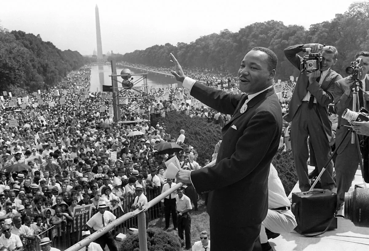 US civil rights leader Martin Luther King Jr. (C) waves to supporters from the steps of the Lincoln Memorial on Aug. 28, 1963, at the Mall in Washington, DC, during the "March on Washington." (AFP/Getty Images)