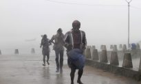 Strong Cyclone Lashes India; Typhoon Vongfong Hits Japan
