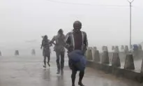 Strong Cyclone Lashes India; Typhoon Vongfong Hits Japan