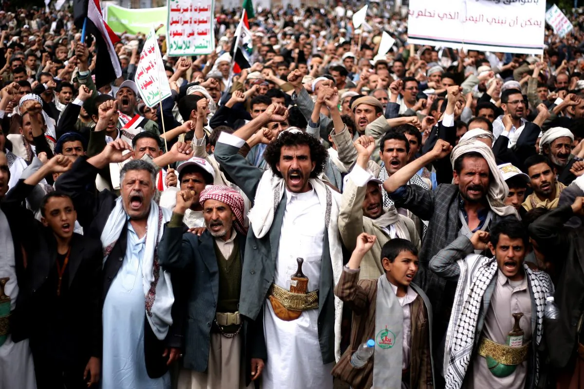 Houthi shiite rebels chant slogans during a protest near the site of a suicide bombing in Sanaa, Yemen, Thursday, Oct. 9, 2014. A suicide bomber struck at the center of the Yemeni capital of Sanaa on Thursday, setting off his explosives at a gathering of supporters of the rebel Shiite Houthis who recently overran the city, security officials said. (AP Photo/Abdullrhman Huwais)