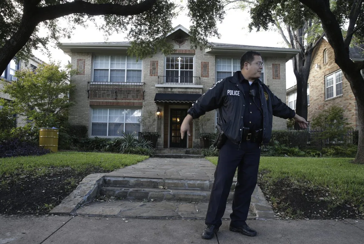 Police stand guard outside the apartment of a hospital worker who tested positive for the Ebola virus in Dallas, Texas on Sunday. (AP Photo/LM Otero)
