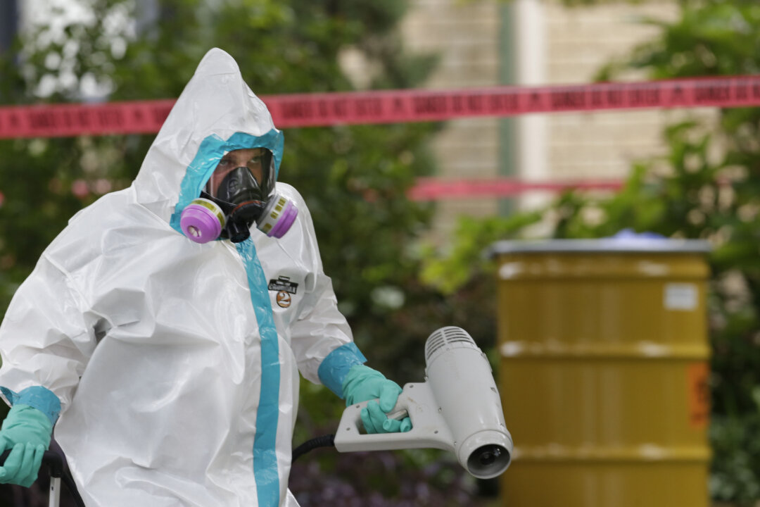 A hazmat worker is seen, in a file photo. (AP Photo/LM Otero)