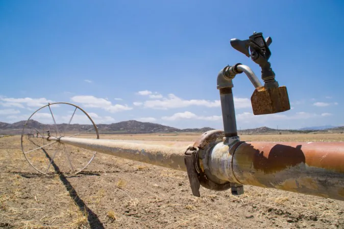 The water irrigation pipes in the dry Southern California farmland. (Shutterstock*)