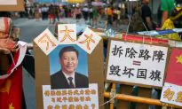 A Lighter Side: Xi Jinping’s Portrait ‘Protects’ Occupy Central Barricades
