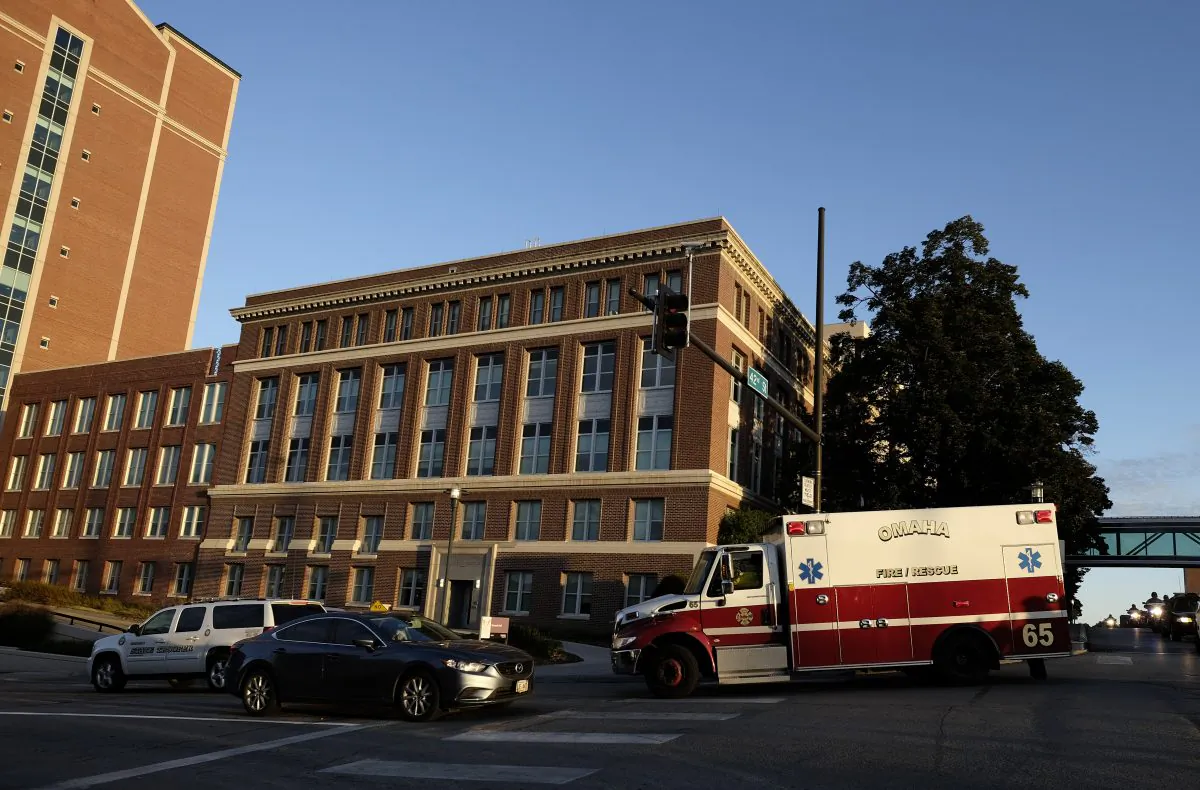 An ambulance carrying an American freelance cameraman who contracted Ebola in Liberia, Ashoka Mukpo, arrives at the Nebraska Medical Center in Omaha, Neb., on Oct. 6, 2014. Mukpo is the fifth American diagnosed with Ebola and is reported to be in good spirits. (Eric Francis/Getty Images)