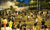 Hong Kong Chief Travels to China, Moves Against Protesters Begin