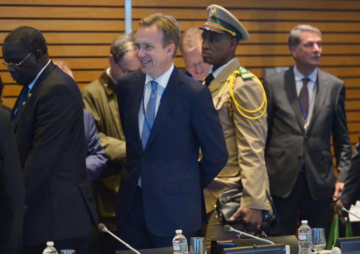 Norway's Foreign Minister Børge Brende (2nd L) arrives for a meeting on the impact of the Ebola crisis, during the IMF World Bank 2014 Annual Meetings in Washington, D.C., on Oct. 9, 2014. At left is Guinea President Alpha Conde. (Mandel Ngan/AFP/Getty Images)