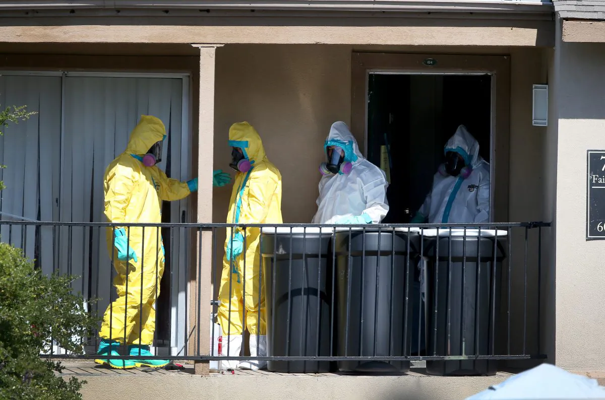 embers of the Cleaning Guys Haz Mat clean up company sanitize the apartment (top R) where Ebola patient Thomas Eric Duncan was staying before being admitted to a hospital on October 5, 2014 in Dallas, Texas. (Joe Raedle/Getty Images)