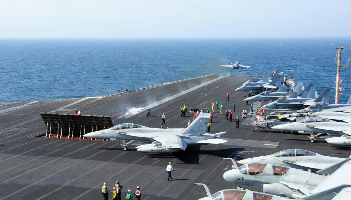 Aircraft launch from the flight deck of the aircraft carrier USS George H.W. Bush (CVN 77), on the Arabian Gulf, Oct. 13, 2014. (US Navy Mass Communication Specialist 3rd Class Joshua Card/US Navy)