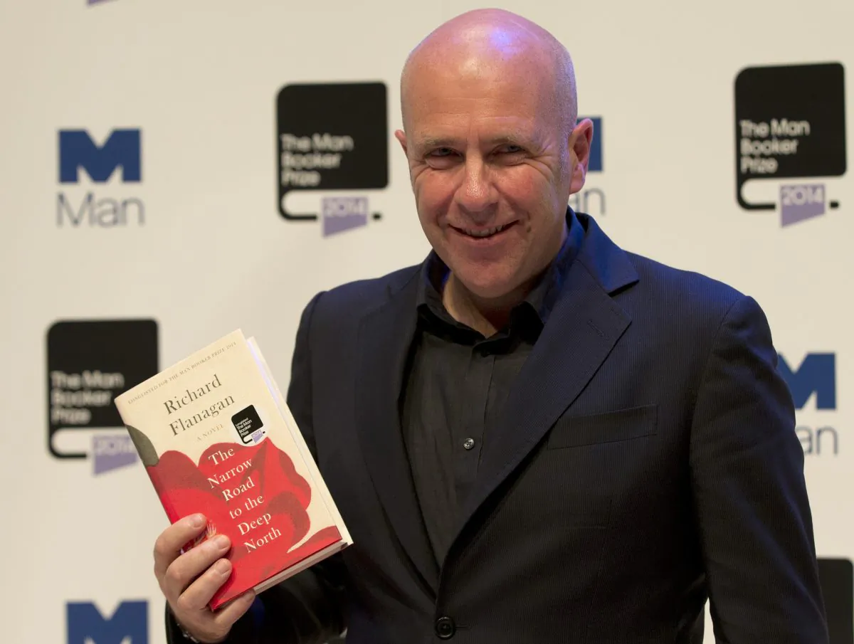 Man Booker prize 2014 nominee Australian author Richard Flanagan holds his book 'The Narrow Road to the Deep North', during a photocall for the Man-Booker for fiction 2014 at the Royal Festival Hall in London, Monday, Oct. 13, 2014. The prize will be awarded on Tuesday night in London. (AP Photo/Alastair Grant)