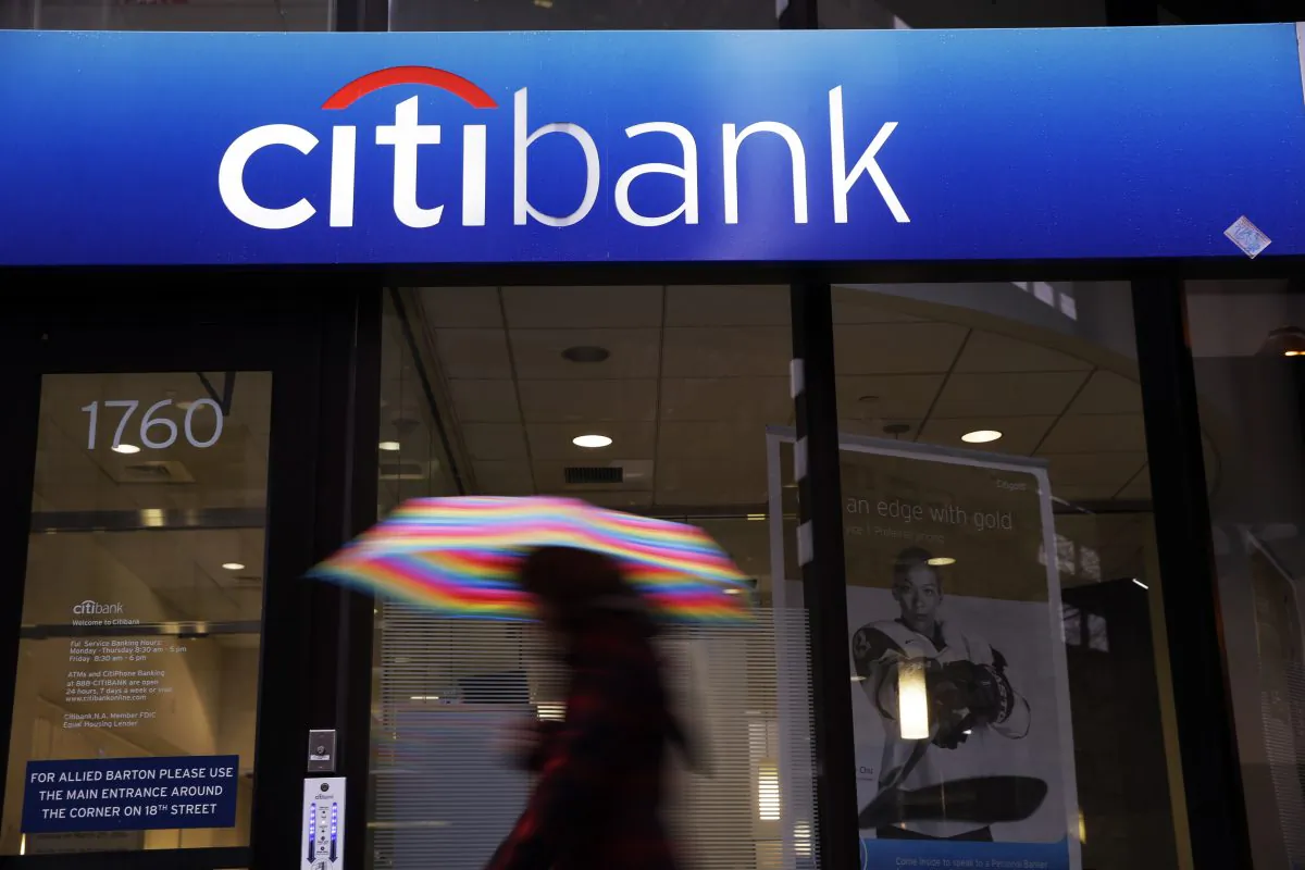A person walks past a Citibank location in Philadelphia on Jan. 14, 2014. Citigroup reports quarterly financial results on Tuesday, Oct. 14, 2014. (AP Photo/Matt Rourke)