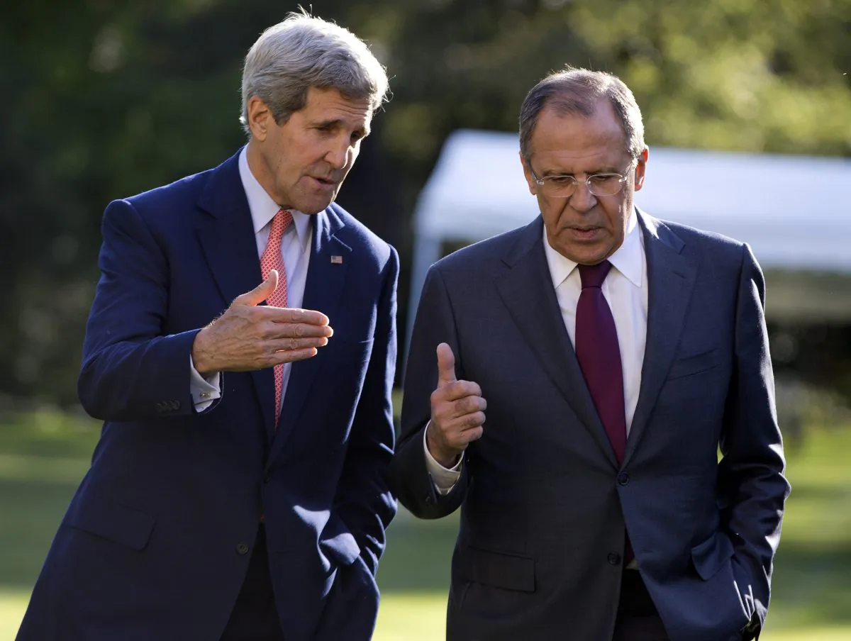 US Secretary of State John Kerry (L) and Russian Foreign Minister Sergey Lavrov talk as they walk together on the grounds of the Chief of Mission Residence in Paris, France, Tuesday, Oct. 14, 2014. The top US and Russian diplomats are hoping to find a way to begin reversing a yearlong spike in tensions stemming from Ukraine's revolution and civil war. (AP Photo/Carolyn Kaster)