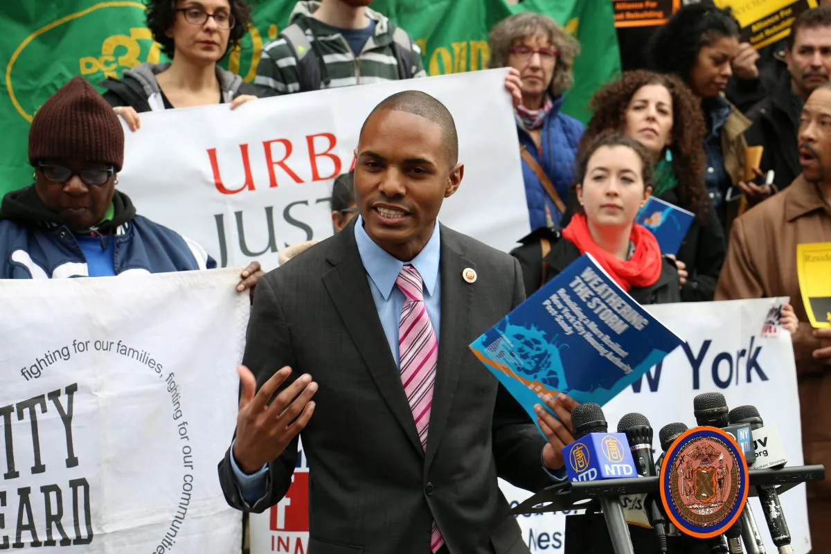 New York City council member Ritchie Torres joins public housing residents gathered at City Hall to call for more funding to help repair damaged buildings, in March 2014. On Tuesday, Oct. 14, 2014, Torres criticized the city's housing authority for its strict eligibility requirements for domestic violence victims to apply for priority housing. (Allen Xie/Epoch Times)