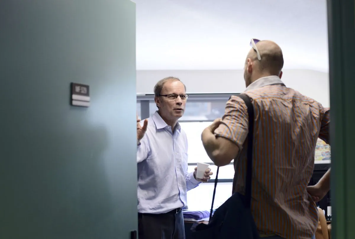 Laureate of the 2014 Nobel Memorial Prize in Economic Sciences, French economist Jean Tirole (C), in his office at the Toulouse School of Economics on Oct. 13, 2014. Tirole is a master of game theory and industrial organization. (Remy Gabalda/AFP/Getty Images)