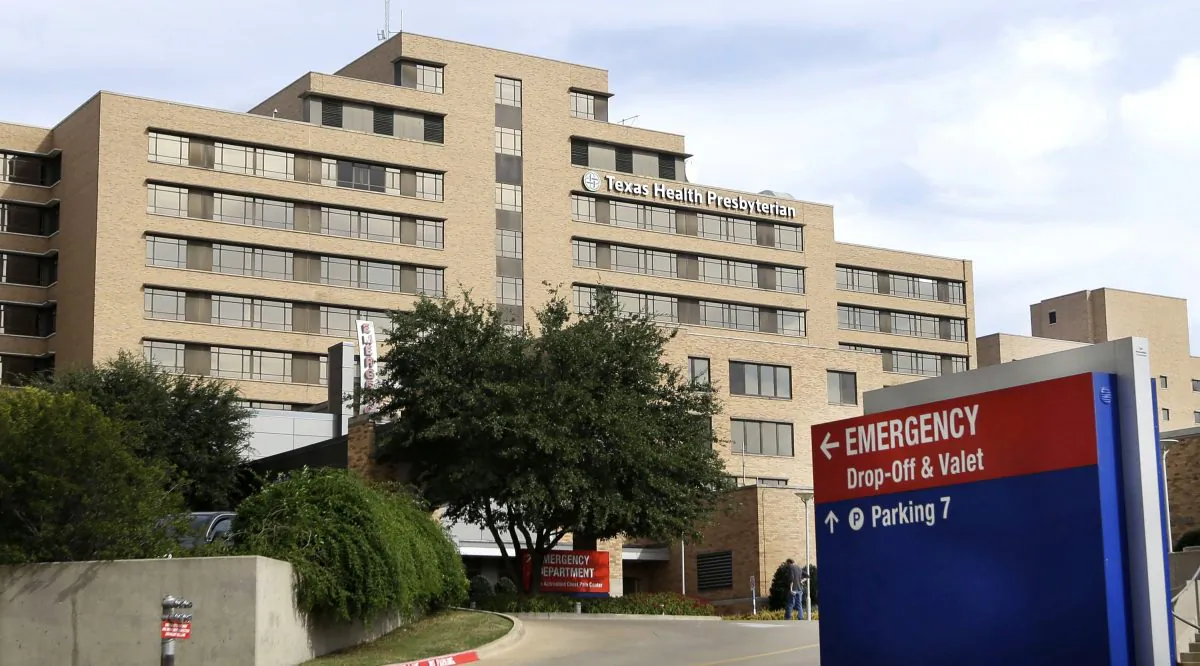 FILE - In this Oct. 8, 2014 file photo, a sign points to the entrance to the emergency room at Texas Health Presbyterian Hospital Dallas, where U.S. Ebola patient Thomas Eric Duncan was being treated, in Dallas. The Liberian Ebola patient was left in an open area of the Dallas emergency room for hours, and the nurses treating him worked for days without proper protective gear and faced constantly changing protocols, according to a statement released late Tuesday Oct. 14, 2014 by the largest U.S. nurses' union. (AP Photo/LM Otero, File)