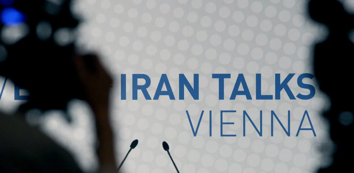 Video cameras stand in front of a poster of the Iran talks during closed-door nuclear talks at a hotel in Vienna, Austria, Tuesday, Oct. 14, 2014. With differences still unresolved and the deadline for a deal nearing, Iran and the US have a choice to make: Extend nuclear talks for a second time or face the risk of renewed confrontation and armed conflict. US Secretary of State John Kerry meets Wednesday in Vienna with Iranian Foreign Minister Mohammad Javad Zarif to try and advance the talks and meet the target date of Nov. 24. (AP Photo/Ronald Zak)
