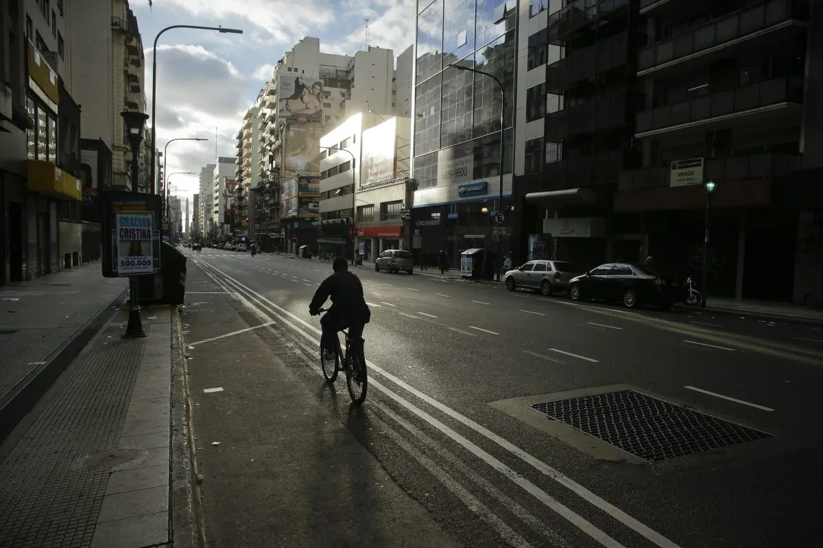 A man rides his bicycle through an empty downtown avenue during a strike in Buenos Aires, Argentina, on Aug. 28, 2014. Just as the US job market has finally strengthened, the Federal Reserve now has to confront a new worry: A sputtering global economy thats spooked investors across the world. (AP Photo/Victor R. Caivano)