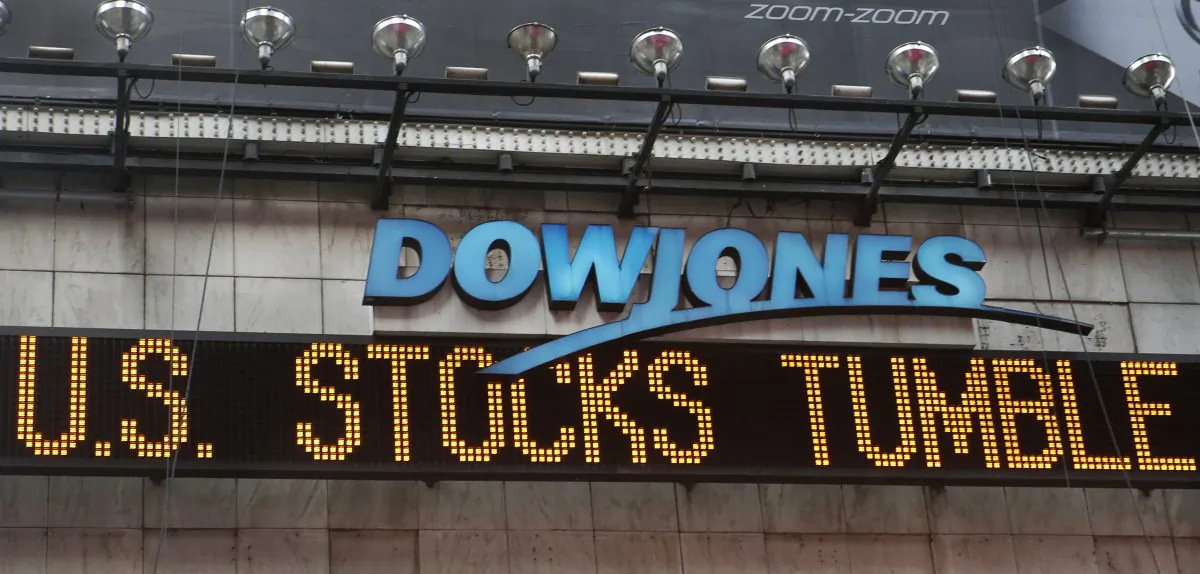 A zipper on the side of One Times Square announces a stock selloff on Wall Street in New York, Wednesday, Oct. 15, 2014. A month-long drop in US stocks intensified in afternoon trading Wednesday, sending the Dow Jones industrial average down more than 400 points and putting the index on track for its biggest loss in more than a year. (AP Photo/Kathy Willens)