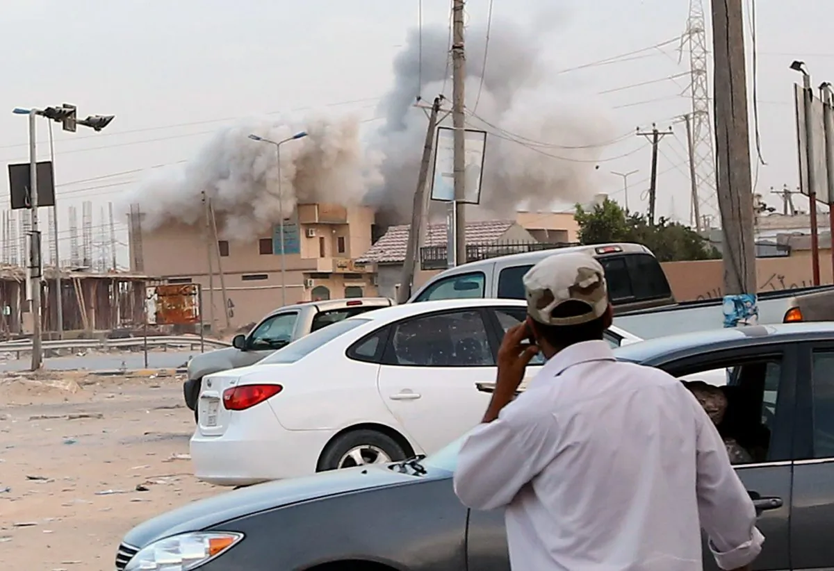 Smoke billows from a building during clashes between militias on September 16, 2014, in the Wershefana suburb of Tripoli, 30 kilometers west of the Libyan capital. (Mahmud Turkia/AFP/Getty Images)