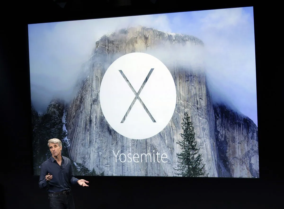 Craig Federighi, senior vice president of Software Engineering at Apple, discusses the operating system update during an event at Apple headquarters on Thursday, Oct. 16, 2014 in Cupertino, Calif. (AP Photo/Marcio Jose Sanchez)