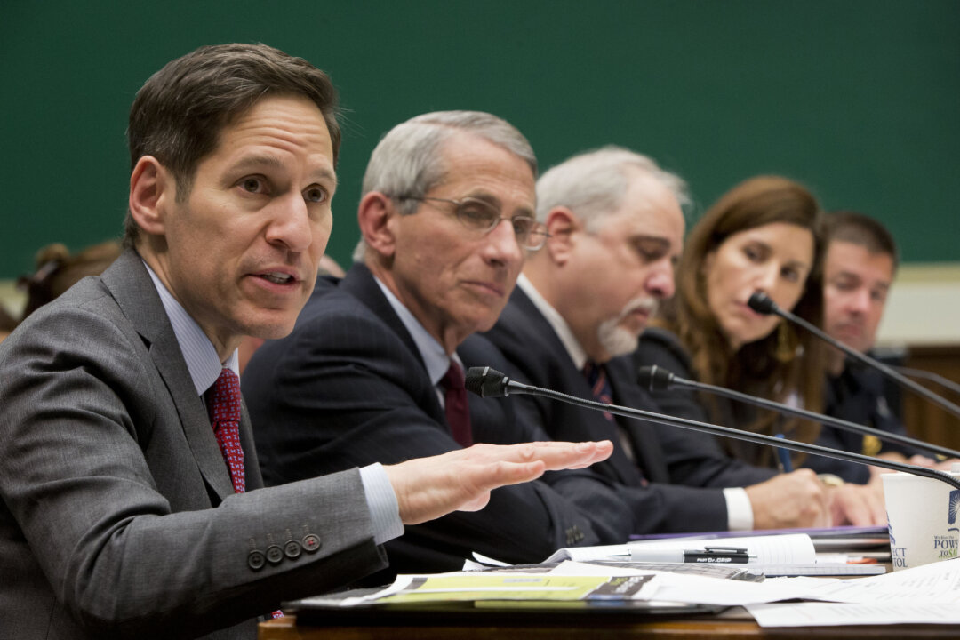 Centers for Disease Control and Prevention (CDC), Director Dr. Tom Frieden (L) testifies as he sits on a panel with (2L-R), Dr. Anthony Fauci, director of The National Institute of Allergy and Infectious Diseases, Dr. Robin Robinson, director of the Biomedical Advanced Research and Development Authority at the US Department of Health and Human Service, Dr. Luciana Borio, assistant commissioner for counterterrorism policy at the US Food and Drug Administration and John Wagner, the Acting assistant Commissioner at the Office of Field Operations for US Customs and Border Protection, testify on Capitol Hill in Washington, Thursday, Oct. 16, 2014, before the House Energy and Commerce Committee's subcommittee on Oversight and Investigations hearing to examine the government's response to contain the disease and whether America's hospitals and health care workers are adequately prepared for Ebola patients. (AP Photo/Pablo Martinez Monsivais)