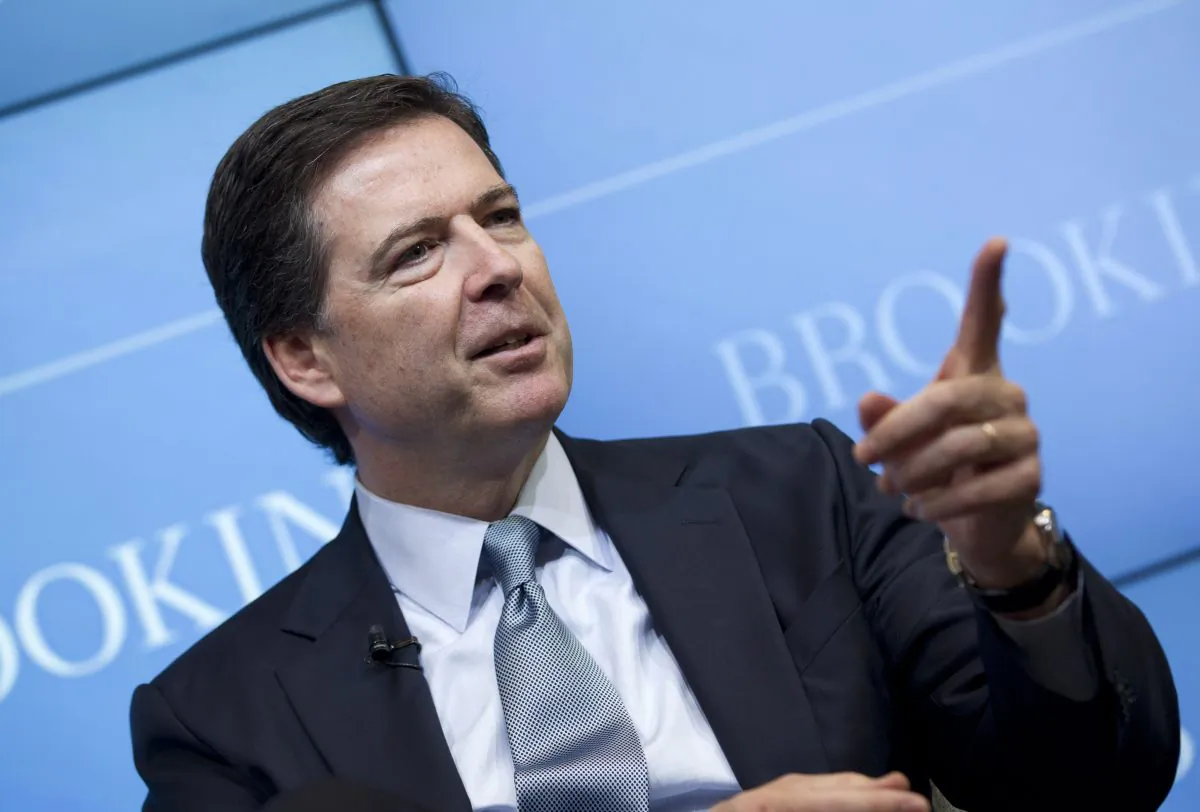 FBI Director James Comey speaks about the impact of technology on law enforcement, Thursday, Oct. 16, 2014, at Brookings Institution in Washington. Comey gave a stark warning Thursday against smartphone data encryption, saying homicide cases could be stalled, suspects could go free and “justice may be denied because of a locked phone or an encrypted hard drive.” (AP Photo/Jose Luis Magana)
