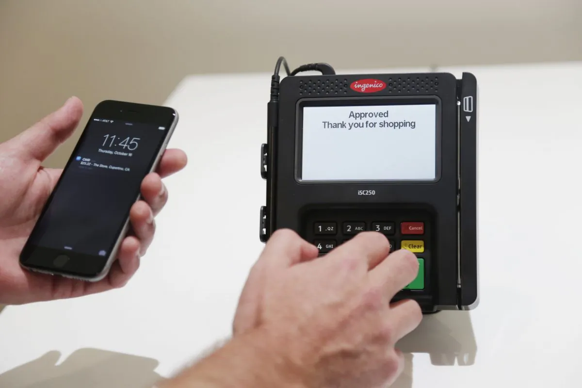 Apple Pay is demonstrated at Apple headquarters in Cupertino, Calif., on Oct. 16, 2014. (Marcio Jose Sanchez/AP Photo)