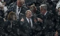 Putin Keeps Merkel Waiting in Milan