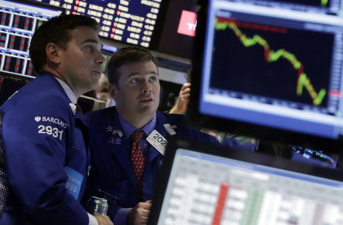 Specialists Robert Tuccillo (L) and Frank Masiello work on the floor of the New York Stock Exchange on Oct. 15, 2014. The market took investors on a wild ride this week. In fact, at one point on Wednesday, the Dow Jones industrial average plummeted 460 points, but pared most of those losses by the end of the trading day. Investors are now wondering what's next for the market. (AP Photo/Richard Drew)