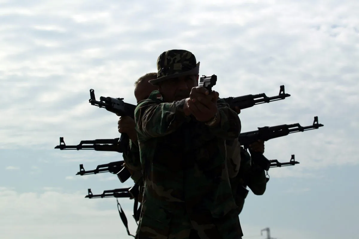 Iraqi Shiite men who have volunteered to join government forces and militias in the fight against jihadists from the Islamic State group, take part in a training session in the central city of Hillah on Oct. 18, 2014. (Haidar Hamdani/AFP/Getty Images)