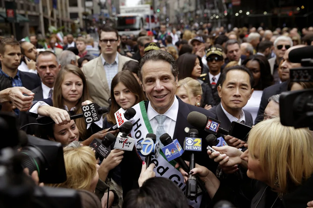 New York Gov. Andrew Cuomo talks with news media before marching in the Columbus Day parade in New York, Oct. 13, 2014. After a hard six months during which he appeared flummoxed by corruption allegations and an embarrassing primary battle, New York’s governor is actively raising his profile, fueling speculation about whether he is already looking beyond his bid for a second term or just trying to run up the score. (AP Photo/Seth Wenig)