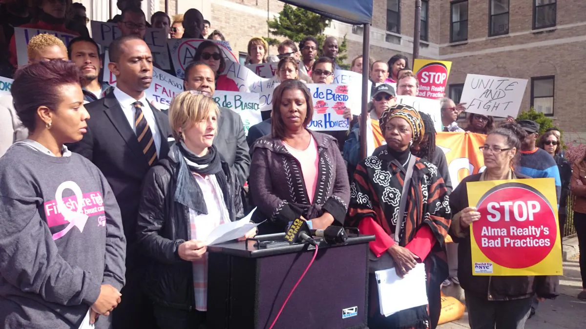 Alethea Adsitt, a tenant at 545 Prospect Place, and tenants from other Alma Realty buildings on the block joined elected officials in a rally for affordable housing, in Brooklyn, Oct. 19, 2014. (Catherine Yang/Epoch Times)