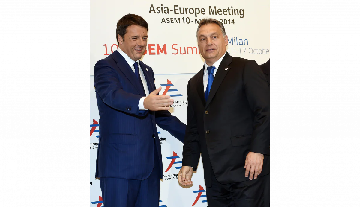 Hungarian Prime Minister Viktor Orban (R) is welcomed by Italian Prime Minister Matteo Renzi before the 10th Asia-Europe Meeting (ASEM) in Milan on Oct. 16, 2014. (Daniel Dal Zennaro/AFP/Getty Images)