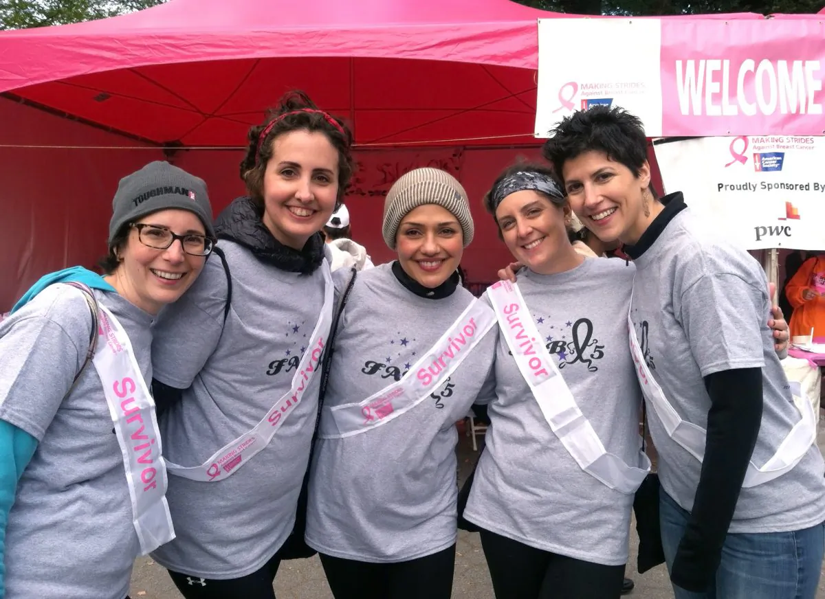 Barbara Trencher (R), 39, poses with her friends at the 21st annual Making Strides Against Breast Cancer walk in Central Park on Sunday, Oct. 19, 2014. Trencher met her breast cancer survivor-friends while in the waiting room at the Memorial Sloan-Kettering Cancer Center, and they have supported each other through the highs and lows of their lives ever since. (Annie Wu/Epoch Times)