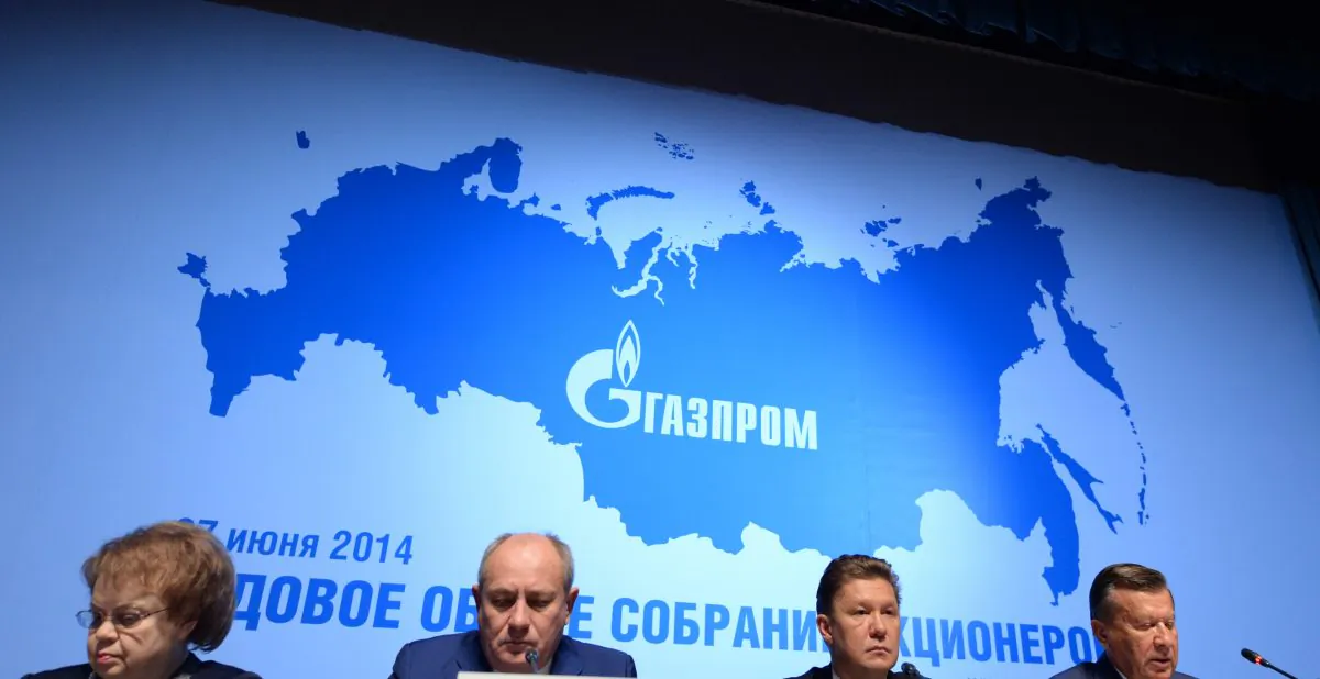Russia’s gas giant Gazprom CEO, Alexei Miller (2nd R), and Gazprom’s board of directors chairman, Viktor Zubkov (R), attend the world biggest gas company’s annual meeting in Moscow on June 27, 2014, with the logo of Gazprom in the background. (Vasily Maximov/AFP/Getty Images)