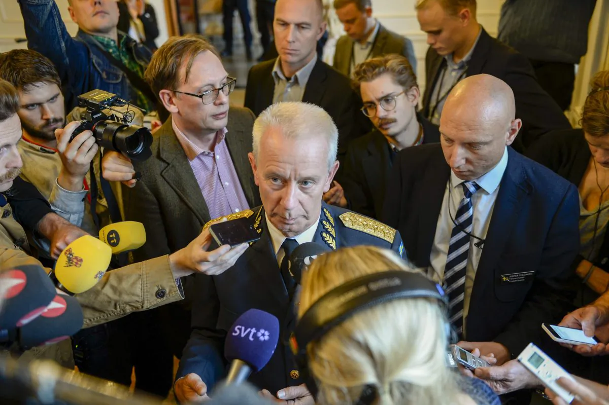 Swedish Commander-in-Chief Sverker Goransson talks to media after a nearly two-hour long meeting with the Swedish Parliament defence committee behind closed doors in Stockholm Tuesday, Oct. 21, 2014. The defence forces are on their fifth day of searching for a suspected foreign vessel in the Stockholm archipelago. (AP Photo/TT News Agency, Pontus Lundahl)