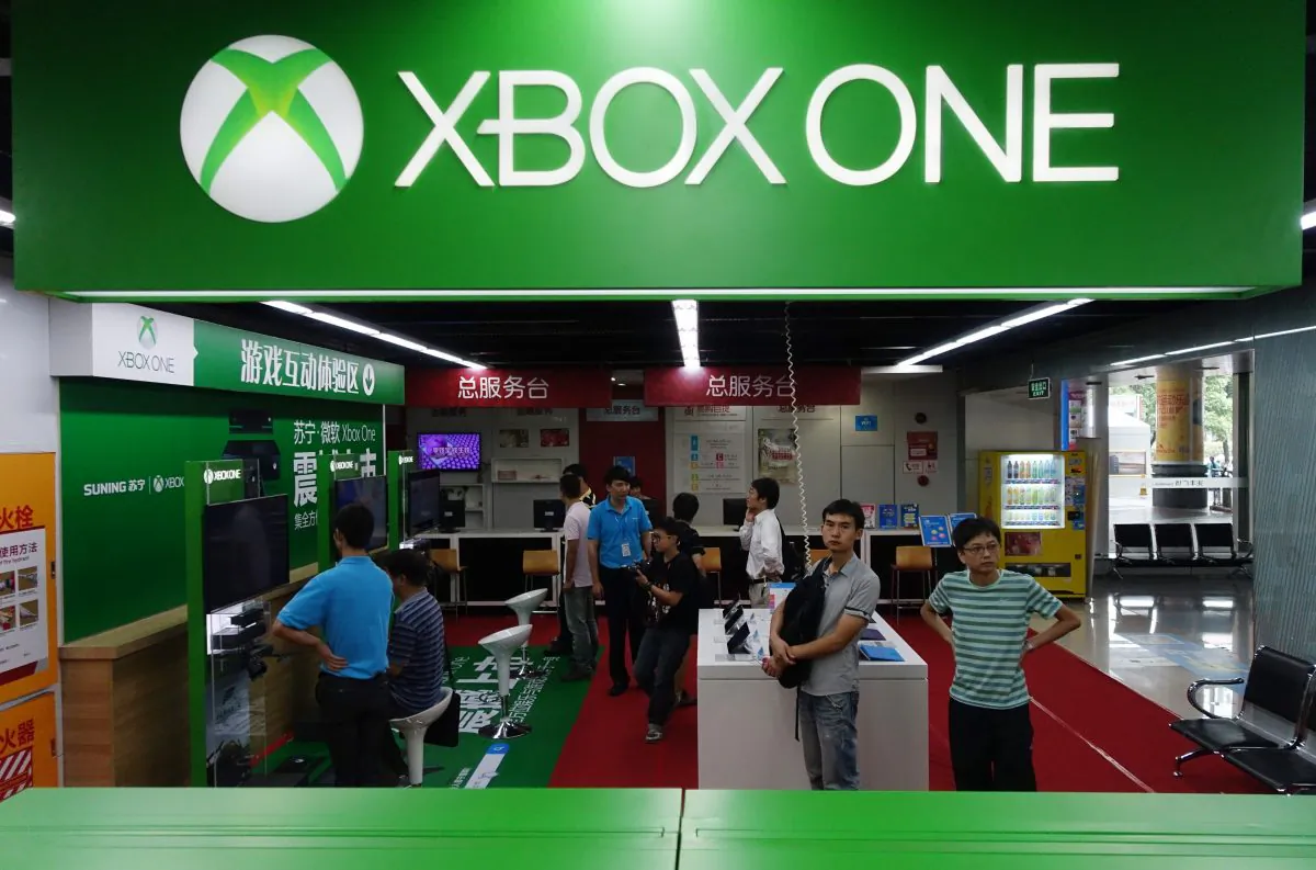 Customers wait insde the Microsoft's Xbox One booth in Shanghai on Sept. 29, 2014. The Xbox One launched in China, the first games console officially released on the mainland after Beijing lifted a ban on the devices, which it had imposed in 2000.( Johannes Eisele/AFP/Getty Images)
