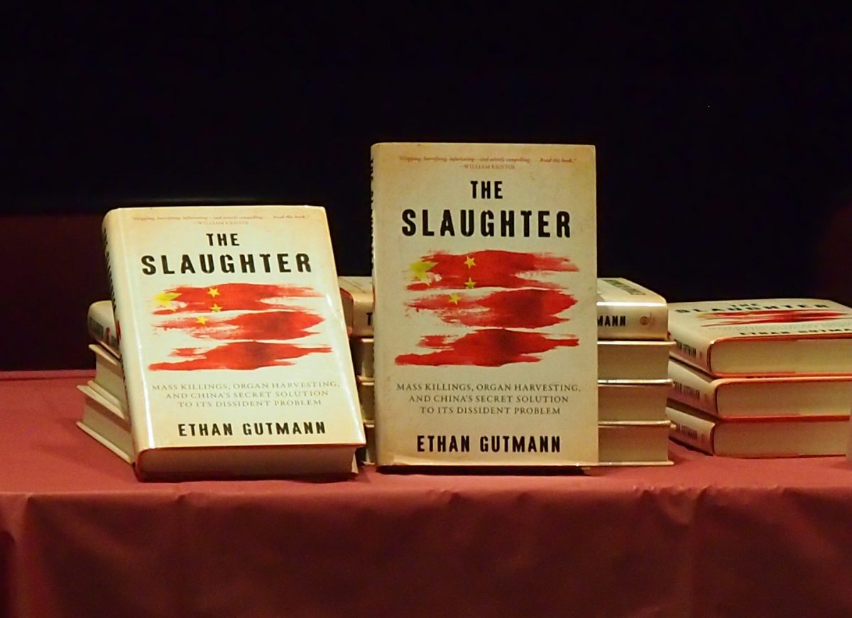 Copies of The Slaughter: Mass Killings, Organ Harvesting, and China’s Secret Solution to Its Dissident Problem are displayed at a discussion forum on Oct. 20 at Concordia University in Montreal. The book sheds new light on the state-orchestrated forced extraction of vital organs from prisoners of conscience in China, who include Falun Gong practitioners, Tibetans, Uyghurs, and House Christians. (Nathalie Dieul/Epoch Times)