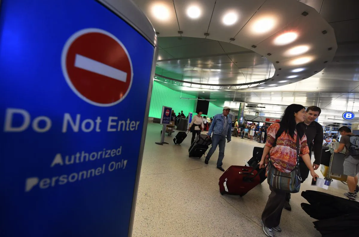 Passengers arrive at the Los Angeles International Airport as the US announced increased passenger screenings against the Ebola Virus on Oct. 9, 2014. (Mark Ralston/AFP/Getty Images)