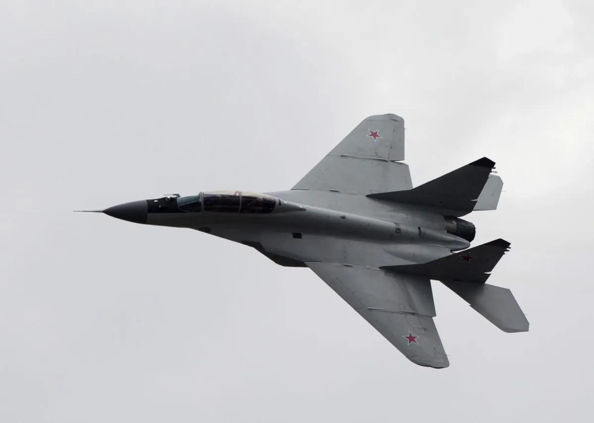 FILE - In this Saturday, Aug. 11, 2012 file photo, a Russian MiG-29 plane flies during a celebration marking the Russian air force's 100th anniversary in Zhukovsky, outside Moscow, Russia. The Syrian air force has destroyed two of three jets seized and reportedly test flown over Aleppo by the Islamic State group last week, according to Omran al-Zoubi, the country's information minister who spoke on Syrian TV late Tuesday, Oct. 21. 2014. Al-Zoubi said that Syrian aircraft bombed the jets as they were landing at Jarrah airbase in the eastern countryside of Aleppo province. He said the militants were able to hide a third jet, which the Syrian air force is now searching for. (AP Photo/Misha Japaridze, File)