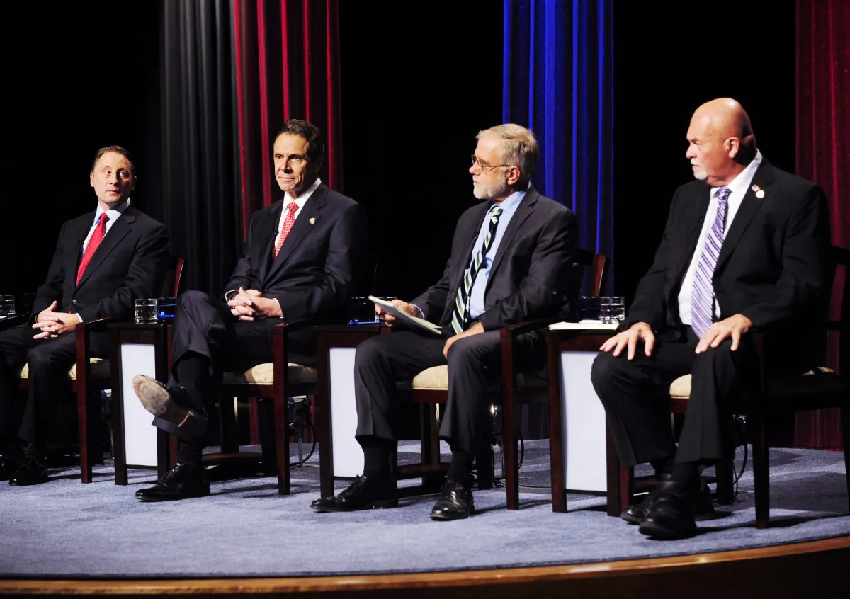 New York State gubernatorial candidates (L-R) Republican candidate Rob Astorino, Democratic incumbent Andrew Cuomo, Green Party candidate Howie Hawkins, and Libertarian Party candidate Michael McDermott take the stage for a debate in Buffalo, N.Y, Oct. 22. (AP Photo/Gary Wiepert)