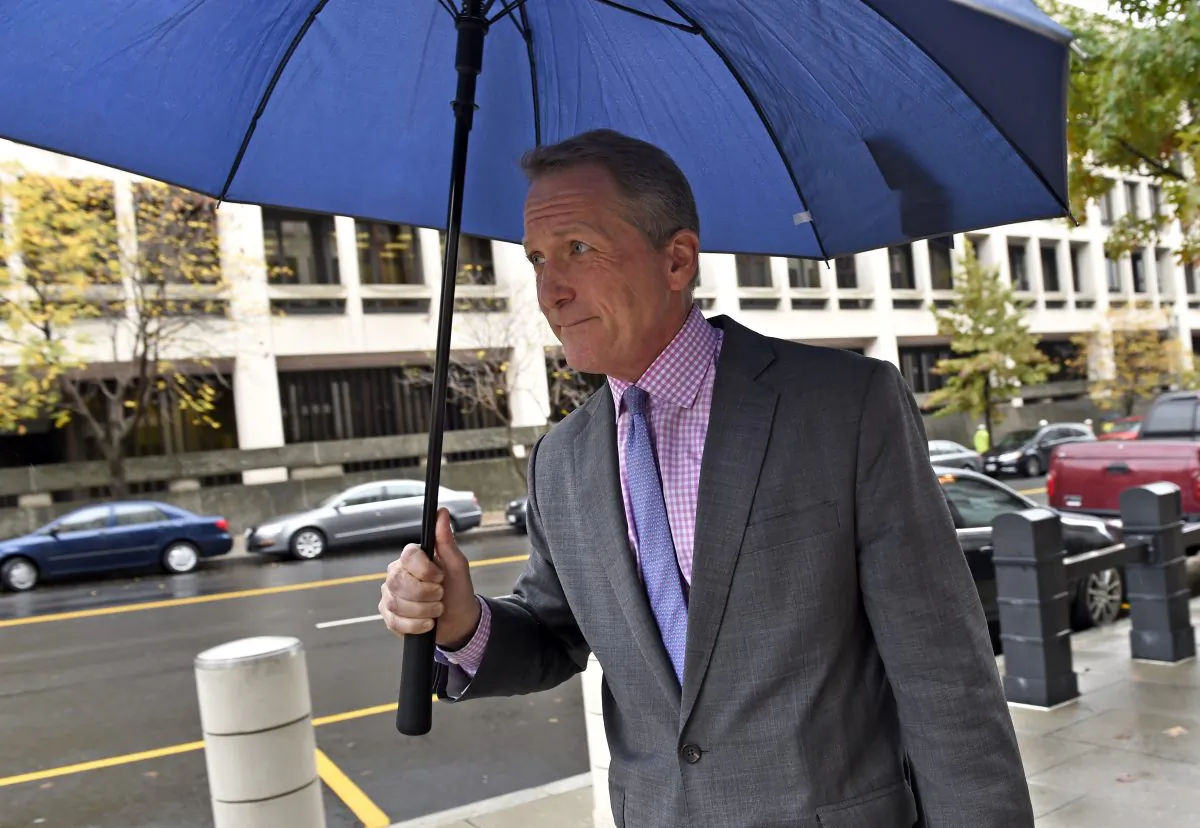Bill Coffield, a lawyer for Blackwater security guard Evan Liberty, leaves Federal Court in Washington, Wednesday, Oct. 22, 2014. Liberty and three other former Blackwater security guards were found guilty Wednesday in the 2007 shootings of more than 30 Iraqis in Baghdad, and a federal judge ordered them immediately to jail. (AP Photo/Susan Walsh)